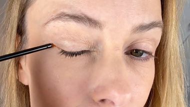 Applying lash serum on clean dry skin