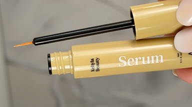 Applying lash serum on clean dry skin
